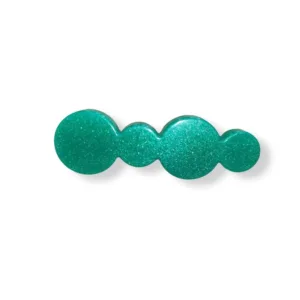 Τσιμπιδάκι από υγρό γυαλί σε σχήμα κύκλων πράσινα