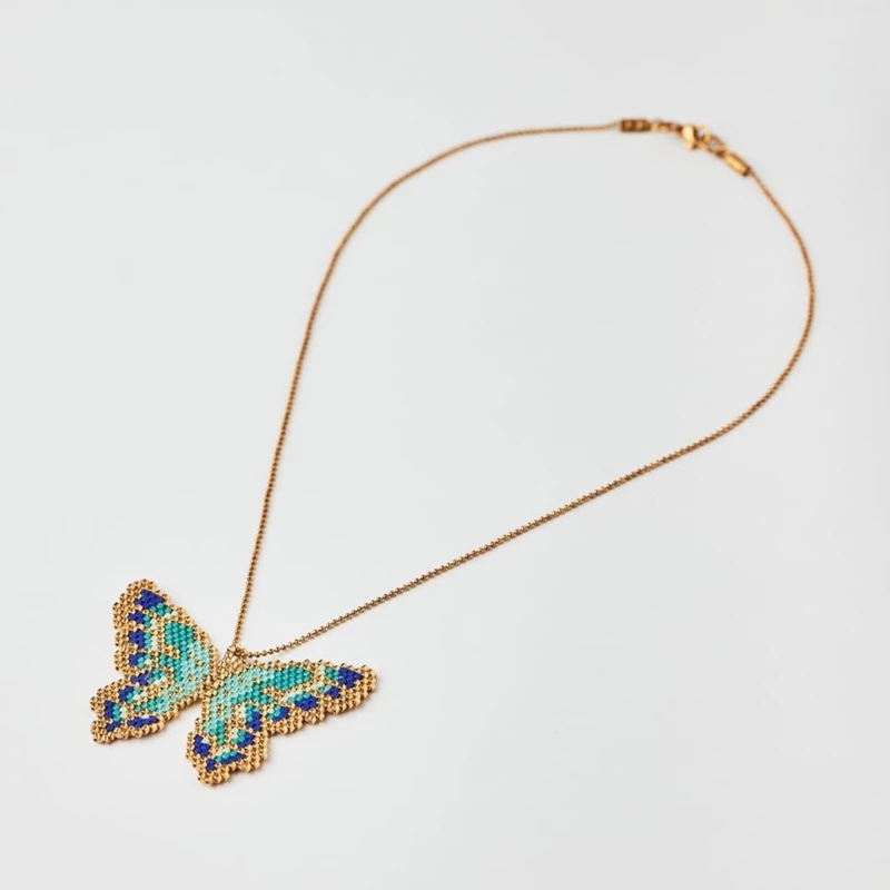 4HV641556-The-Gem-Stories-Miyuki-Butterfly-Blue-Shades